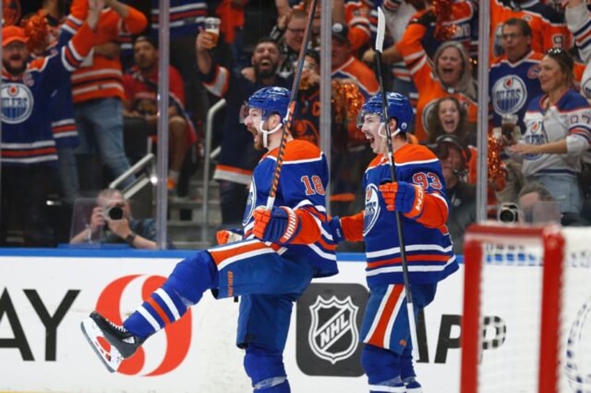 Edmonton's Zach Hyman, left, and Ryan Nugent-Hopkins celebrate after Hyman's breakaway goa