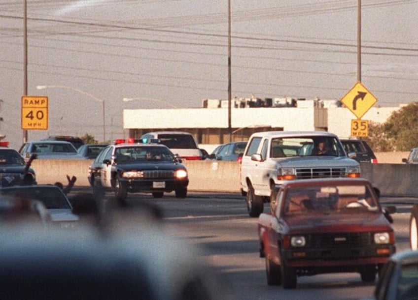 A white Ford Bronco containing a fugitive OJ Simpson led a convoy of police cars down sout