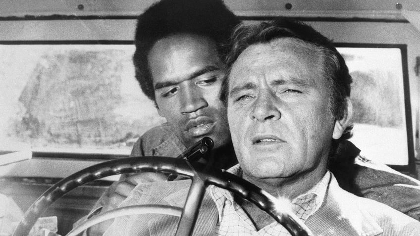 A file photo of OJ Simpson with Richard Burton from The Klansman.