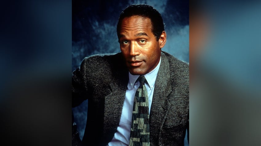 Actor OJ Simpson sports wool blazer and tie as a detective in Naked Gun trilogy.