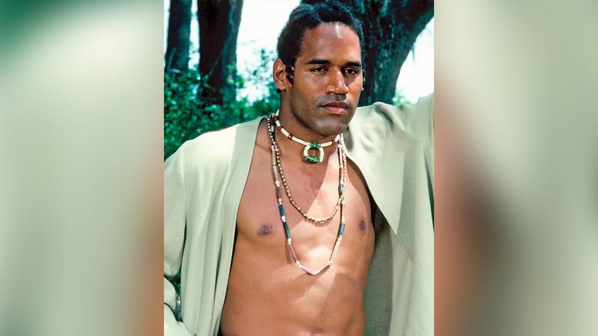 Actor OJ Simpson shows off his chest in Roots portrait.