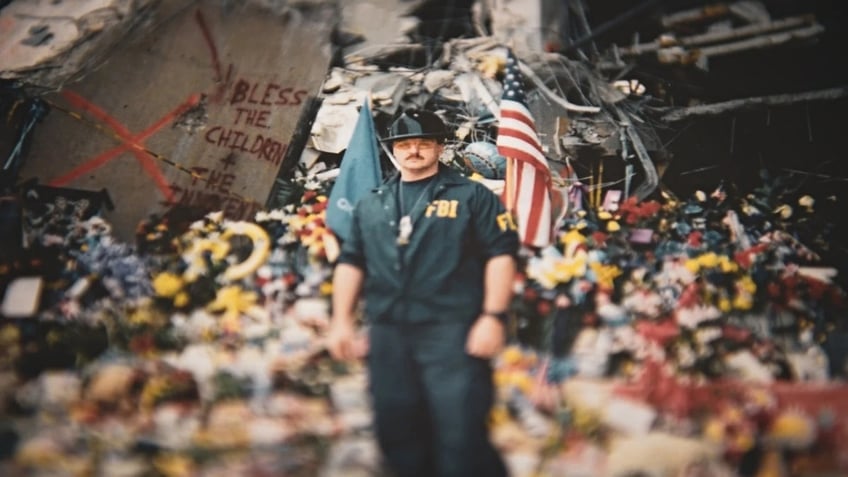 Ret. FBI Agent Barry Black standing at the scene of the Oklahoma City bombing in his FBI uniform