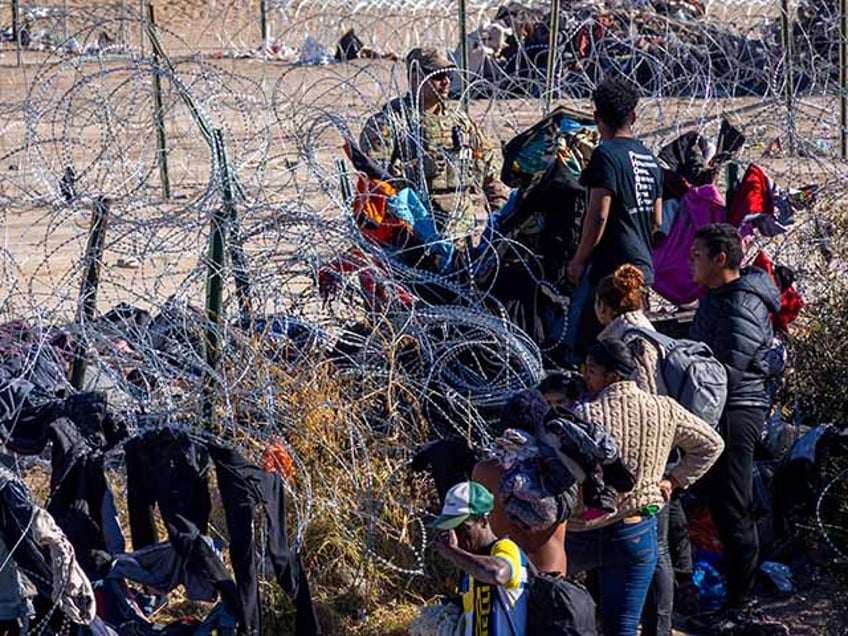 Security forces take measures as hundreds of migrants cross the Rio Grande River to reach the United States seeking humanitarian asylum in Ciudad Juarez, Mexico on December 28, 2023. In recent days, thousands of people have irregularly crossed the border at various points before immigration laws in the United States became stricter. (Photo by David Peinado/Anadolu via Getty Images)