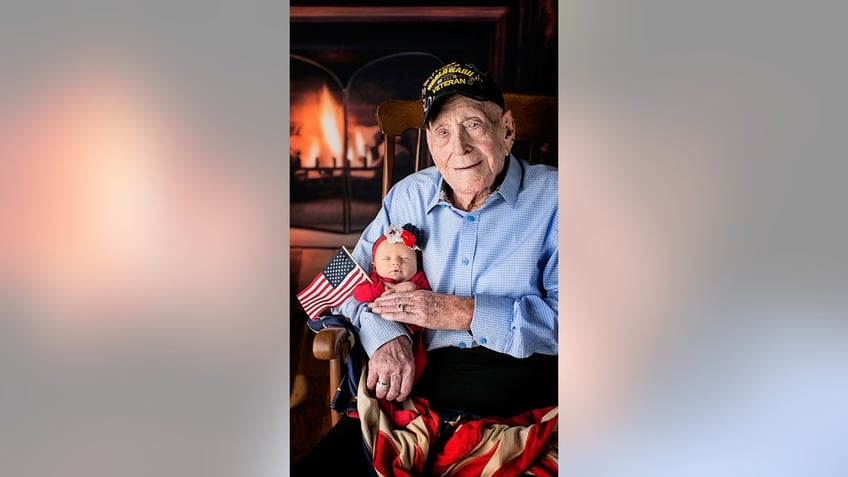 WWII vet holding great great grandaughter