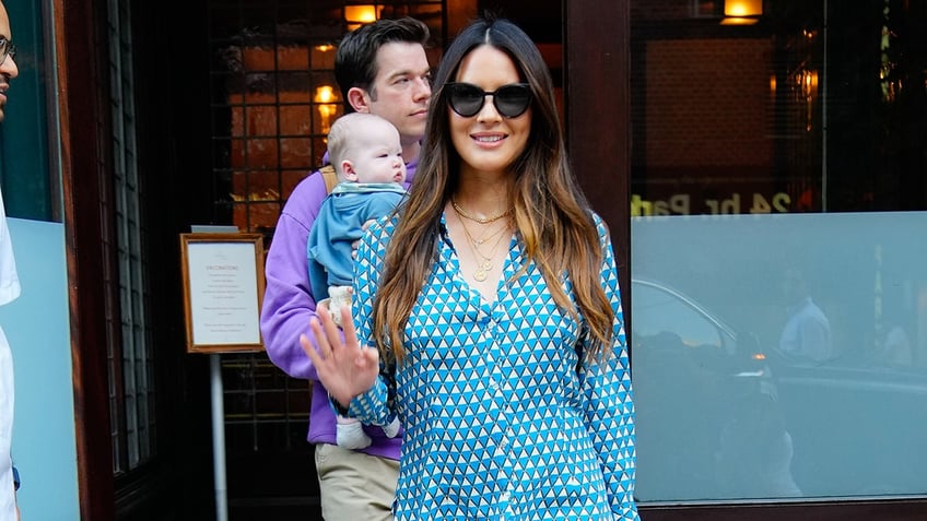 Olivia Munn and John Mulaney with their son