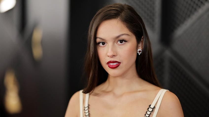 Olivia Rodriguez looks directly at the camera on the carpet at the Grammy Awards