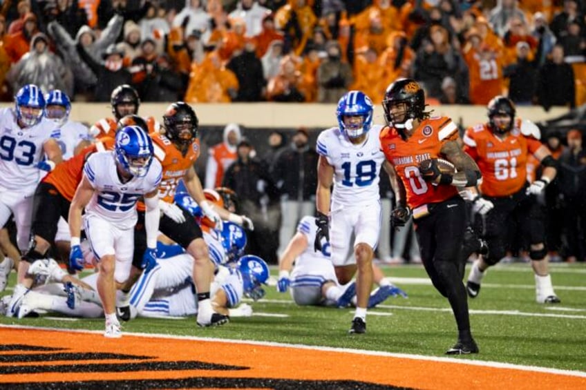 ollie gordon iis 5 tds lead no 21 oklahoma state past byu in 2ot into big 12 title game