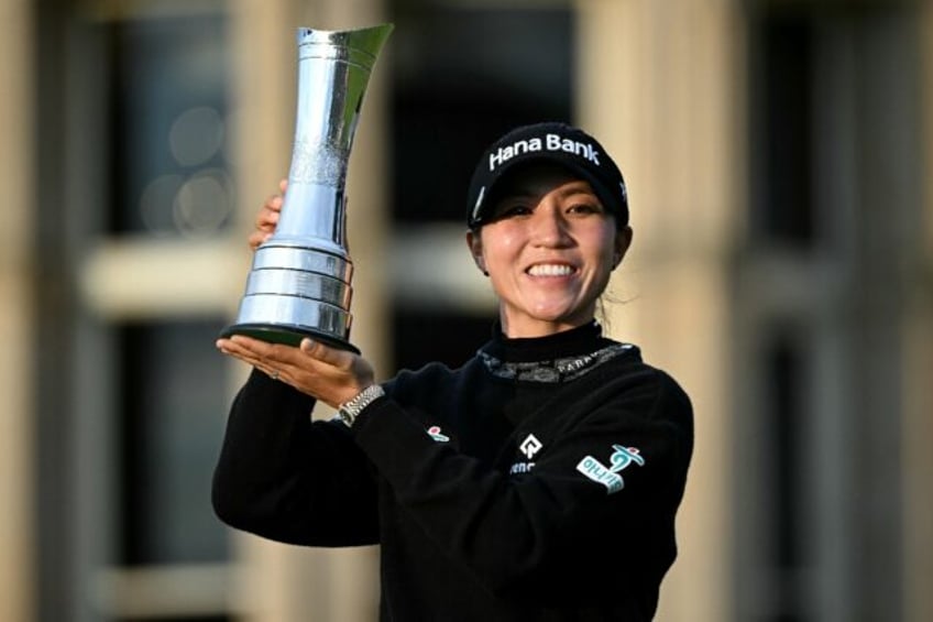 Victory joy: New Zealand's Lydia Ko poses with the trophy after winning the Women's Britis