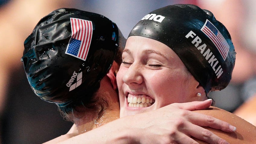 Megan Romano and Missy Franklin celebrate