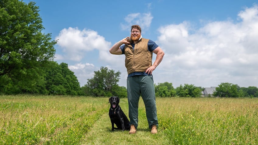 Ryan Crouser poses with Koda