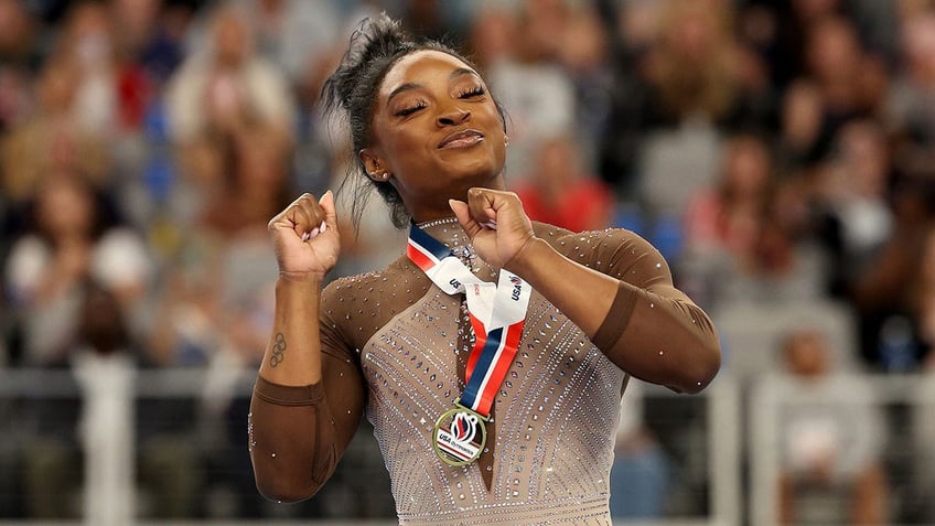 Simone Biles celebrates