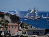 Olympic torch arrives in Marseille on famous ship amid celebration, tight security