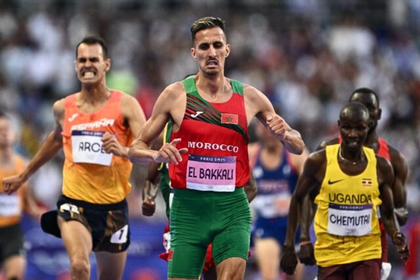 Morocco's Soufiane El Bakkali leads in his men's 3000m steeplechase heat