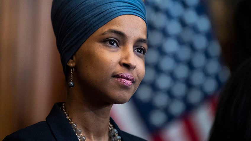 Ilhan Omar squad member smiling