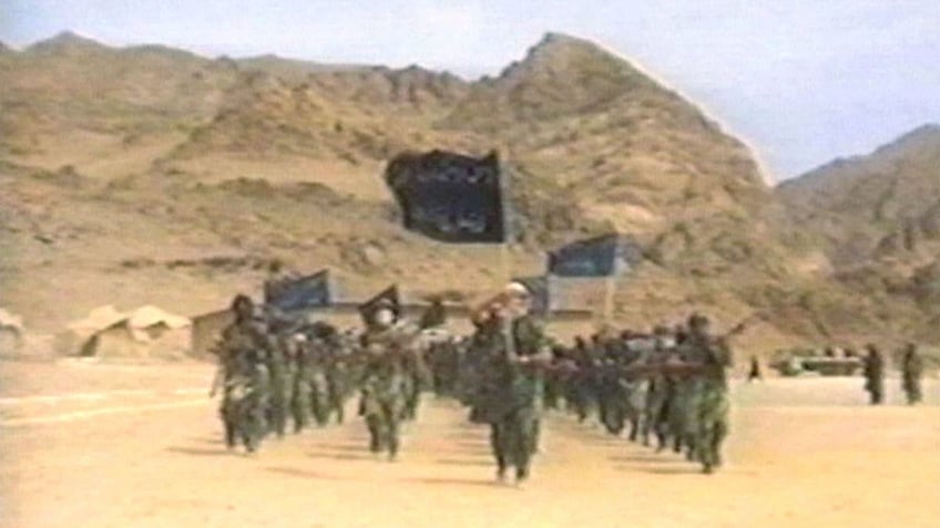 Terrorists participate in military training in this undated still frame from a recruitment video for Usama Bin Laden's extremist al Qaeda network.