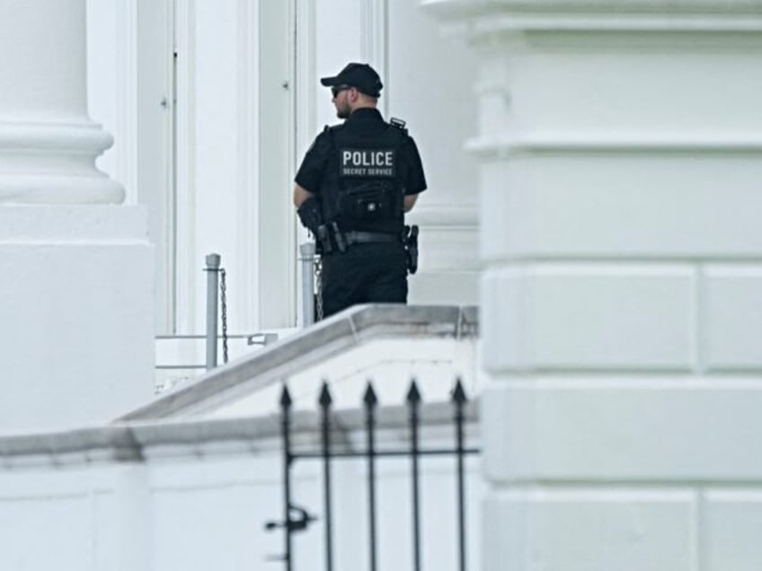 A member of the United States Secret Service stands watch at the White House in Washington