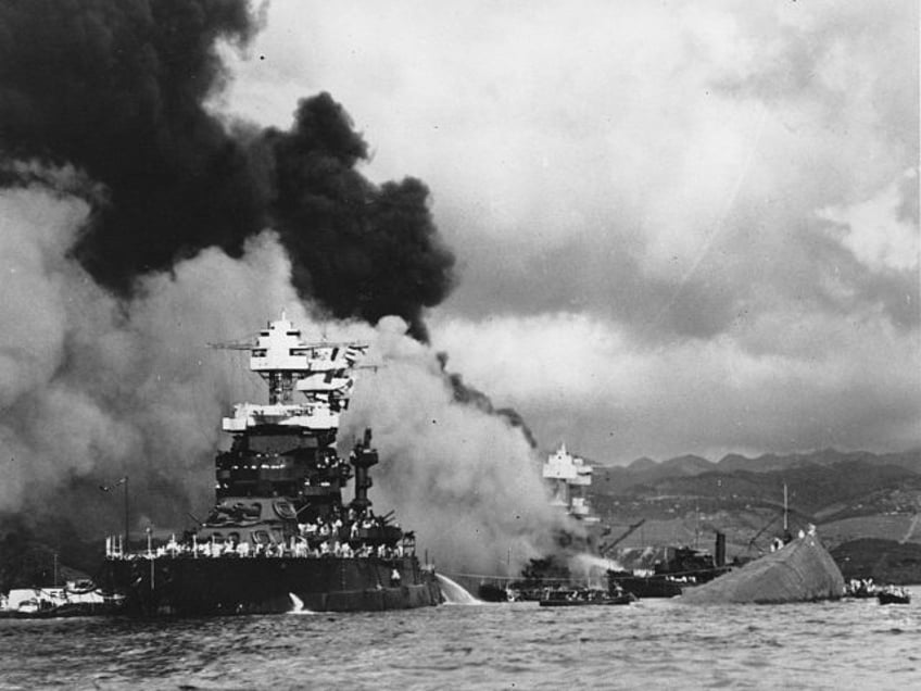 FILE - In this Dec. 7, 1941, file photo, part of the hull of the capsized USS Oklahoma is