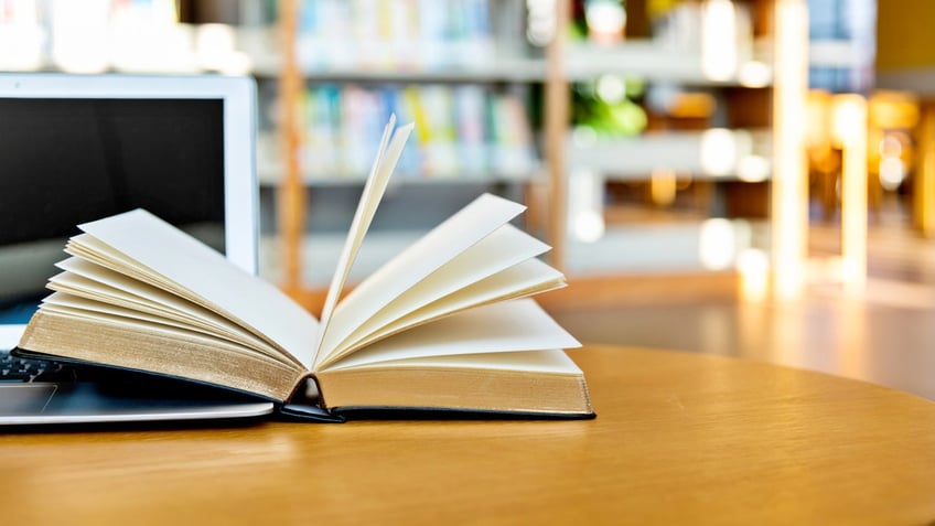 book open on a library table