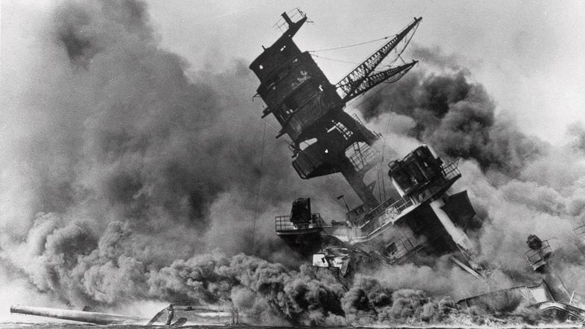 USS Arizona burning