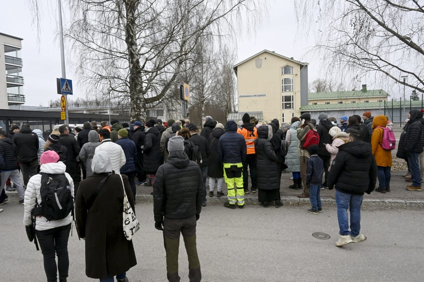 Family members of pupils of the primary Viertola comprehensive school wait to enter the school after a child opened fire and injured three other children, on April 2, 2024 in Vantaa, outside the Finnish capital Helsinki. Police said, that the attacker was in custody, and "All those involved in the shooting incident are minors". (Photo by Markku Ulander / Lehtikuva / AFP) / Finland OUT (Photo by MARKKU ULANDER/Lehtikuva/AFP via Getty Images)