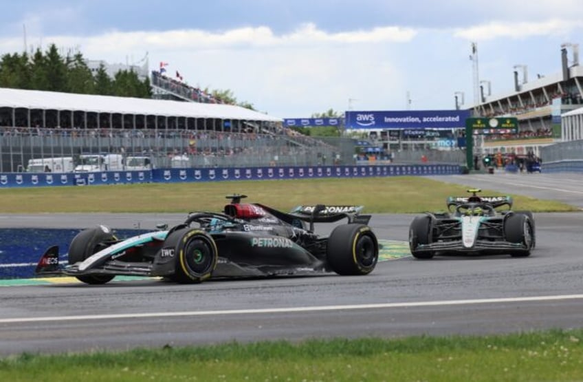 George Russell (left) got the better of teammate Lewis Hamilton as the Mercedes cars recor