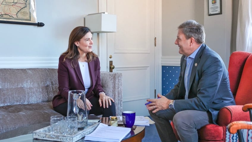 Gov-elect Kelly Ayotte (left) and Gov. Chris Sununu (right) meet in the New Hampshire governor's office, in the Statehouse in Concord, N.H., on Nov. 7, 2024 