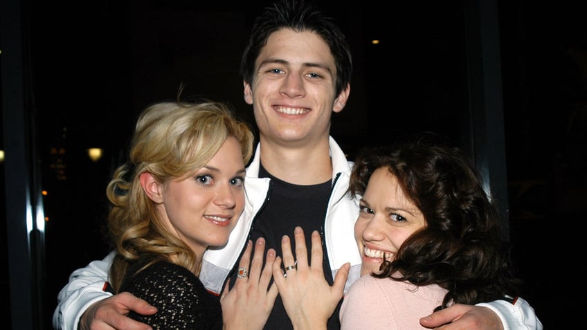 Hilary Burton, James Lafertey and Bethany Joy Lenz hugging