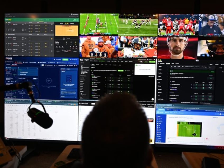 SOUTHAMPTON, PA - NOVEMBER 26: Ken Huber monitors game activity during NFL games from his