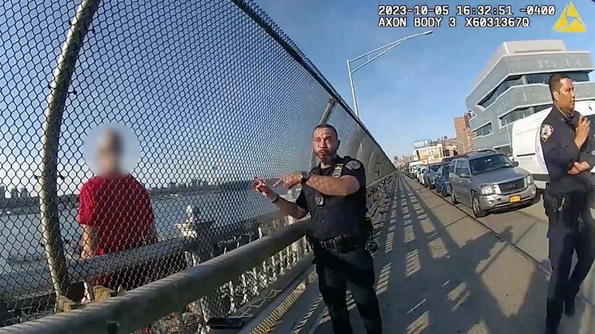 onlookers cheer police officer who breaks down in tears after nerve wracking rescue of suicidal man on ledge