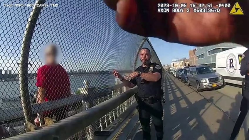 onlookers cheer police officer who breaks down in tears after nerve wracking rescue of suicidal man on ledge