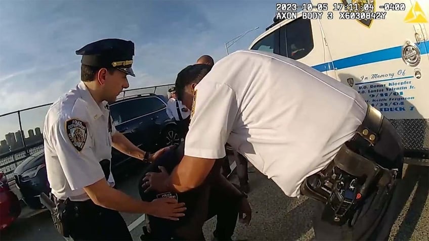 onlookers cheer police officer who breaks down in tears after nerve wracking rescue of suicidal man on ledge