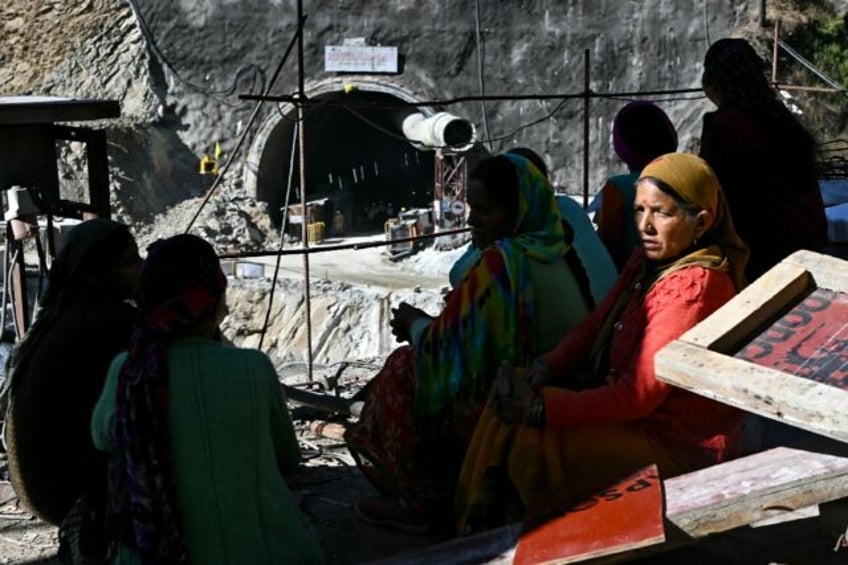 only wait indian families pray for release of trapped tunnel workers