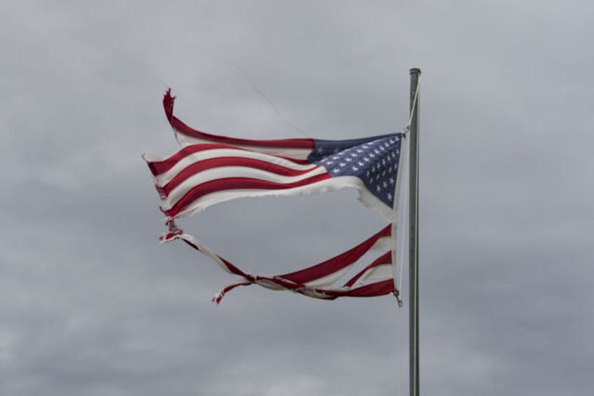 MATAGORDA, TEXAS - JULY 8: A tattered American flag flies in the wind after Hurricane Bery