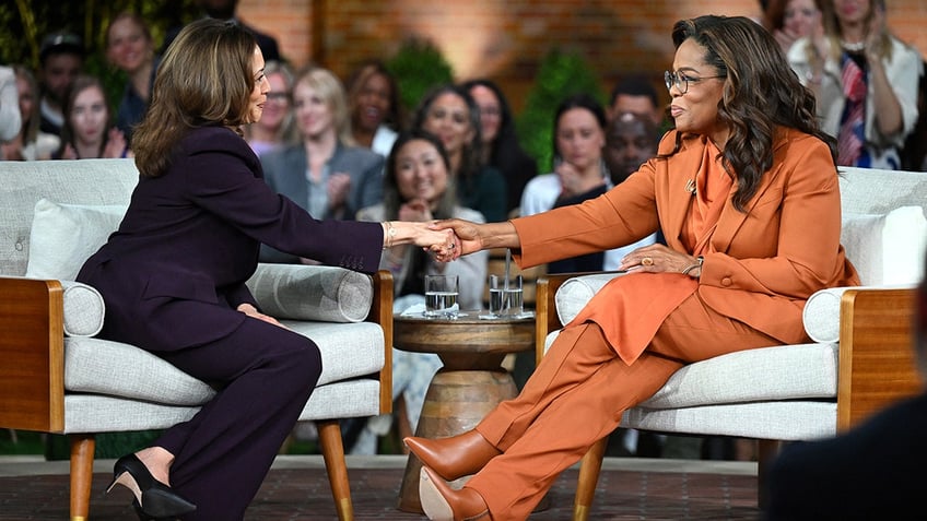 Kamala Harris shaking Oprah's hand