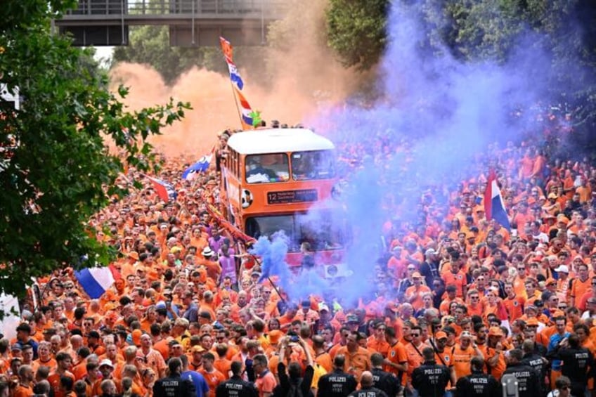 Dutch fans cheer in the streets of Dortmund ahead of Netherlands' Euro 2024 semi-final cla