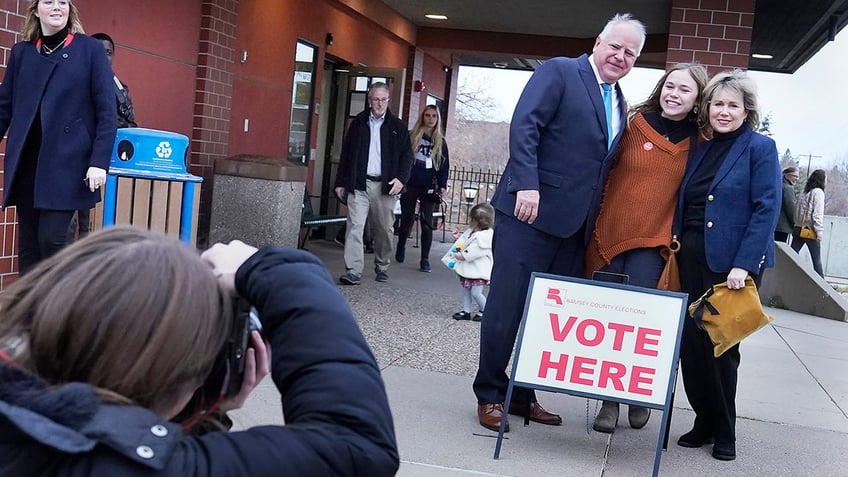 Walz posing for photo at polling place