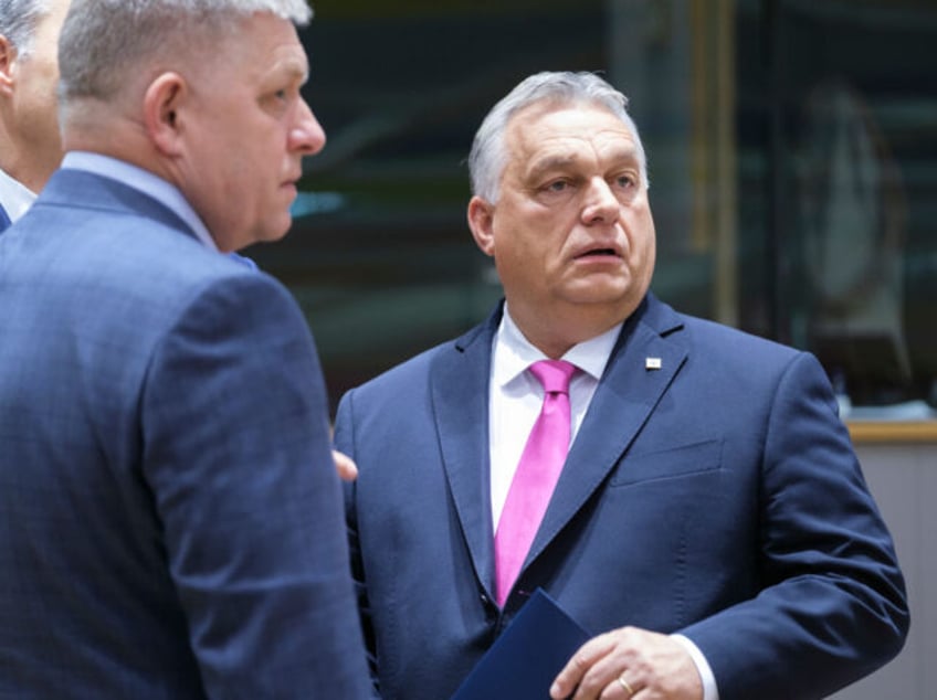 BRUSSELS, BELGIUM - OCTOBER 26: Belgium Prime Minister Alexander De Croo (L) is talking with the Slovak Prime Minister Robert Fico (C) and the Hungarian Prime Minister Viktor Mihaly Orban (R) prior an EU Summit on October 26, 2023 in Brussels, Belgium. After days spent deliberating on the language in …