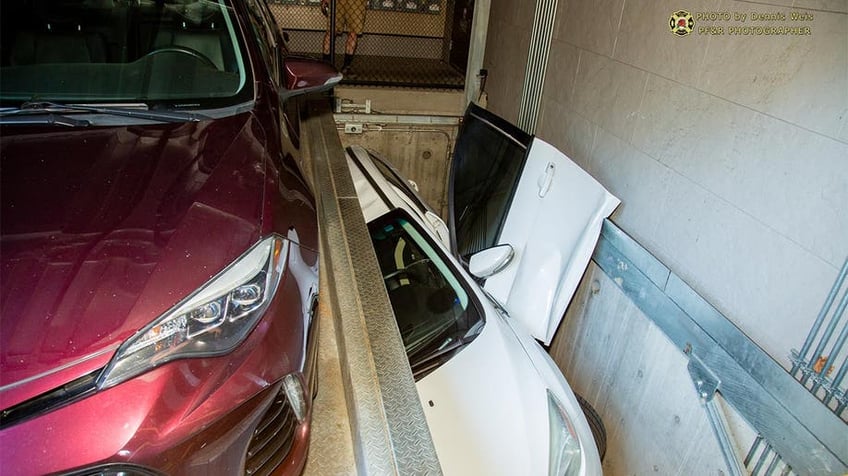 oregon driver gets trapped in portland rotating parking system