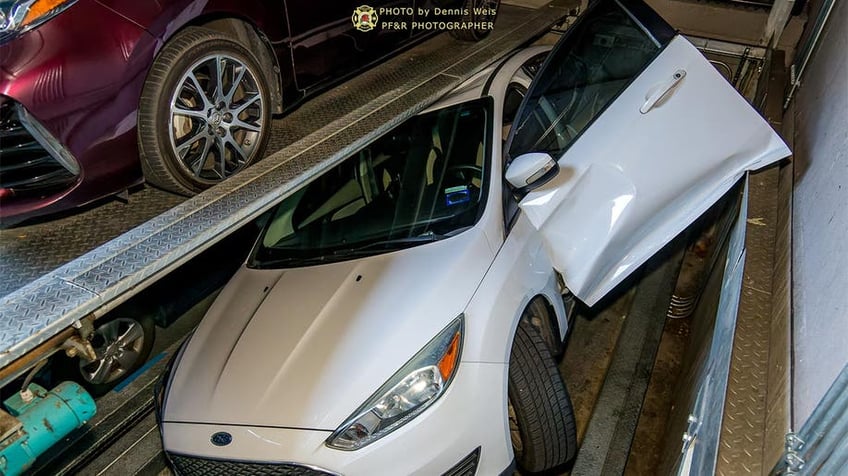 oregon driver gets trapped in portland rotating parking system