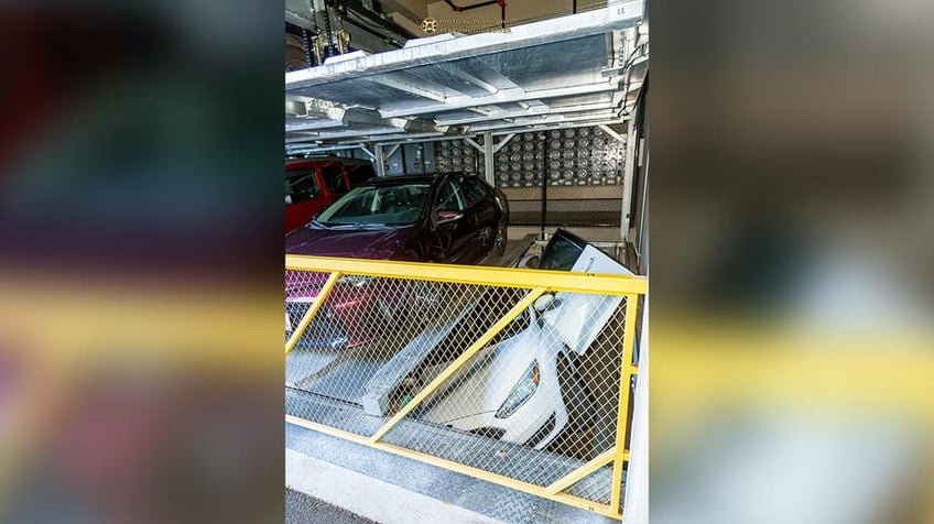 oregon driver gets trapped in portland rotating parking system