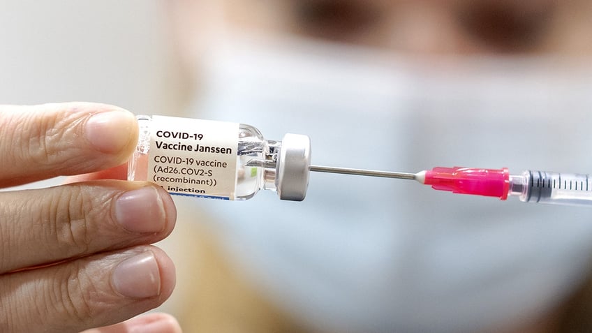 A woman fills a syringe with the COVID-19 Janssen vaccine in Nieuwegein, Netherlands, in June. A federal judge recently rejected a bid challenging Oregon's COVID-19 vaccine mandate.