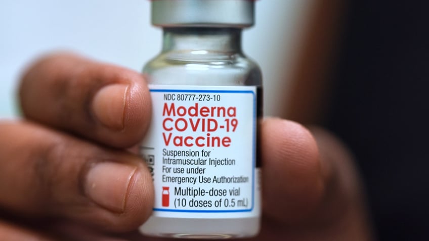 Dr. Salma Elfaki holds a vial of Moderna COVID-19 vaccine at a Moderna clinical trial for adolescents being conducted by Accel Research Sites with Nona Pediatric Center in Orlando, Florida. Recently, a judge denied a bid to stop Oregon's vaccine mandate.