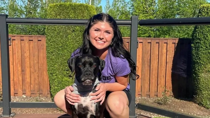 Kaileigh Seidel poses with her dog