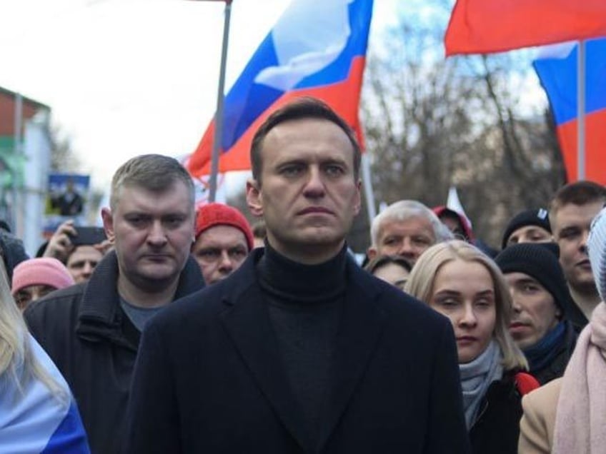 Russian opposition leader Alexei Navalny, his wife Yulia, opposition politician Lyubov Sob