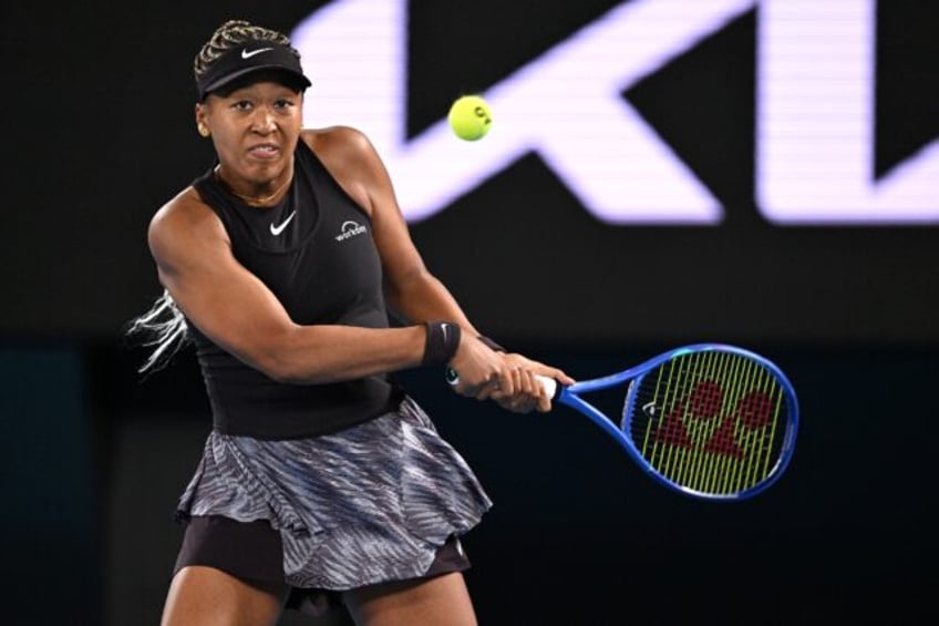 Japan's Naomi Osaka hits a shot against France's Caroline Garcia