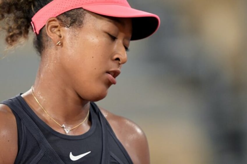 Slipped away: Naomi Osaka on her way to defeat against Iga Swiatek having squandered a mat
