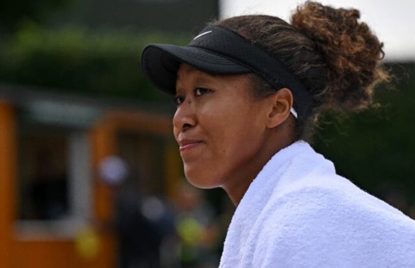 Just need 'luck': Japan's Naomi Osaka takes part in a training session at Wimbledon on Sun