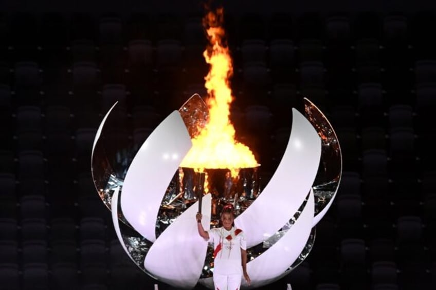 Olympic return? Naomi Osaka lights the cauldron at the opening ceremony of the Tokyo Games
