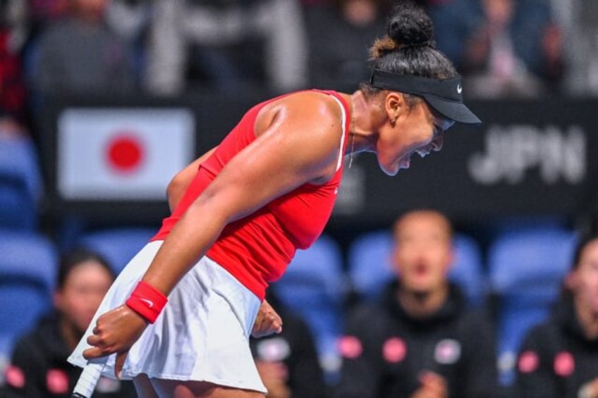 Winning moment: Japan's Naomi Osaka reacts after a point against Kazakhstan's Yulia Putint