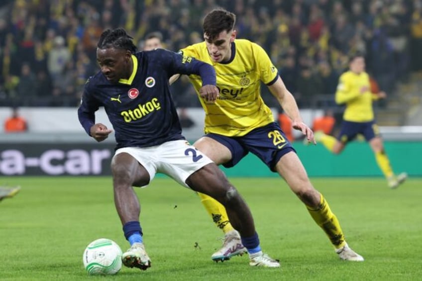 Fenerbahce's Nigerian defender Bright Osayi-Samuel (L) in action during a UEFA Conference